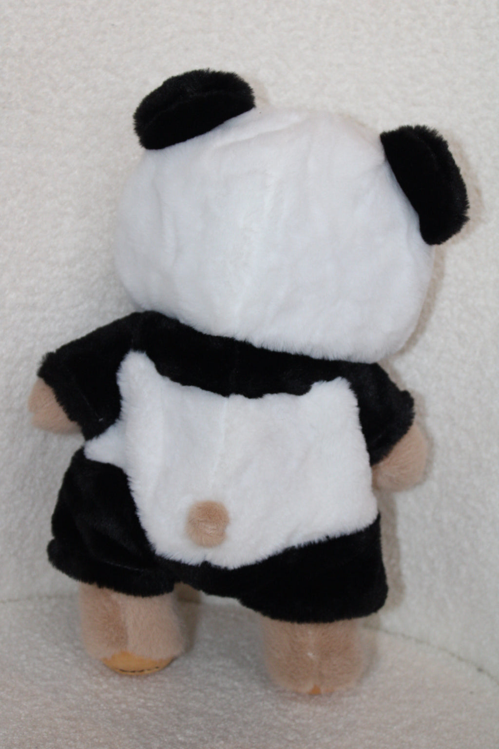 Peluche d’ours deguisé en panda