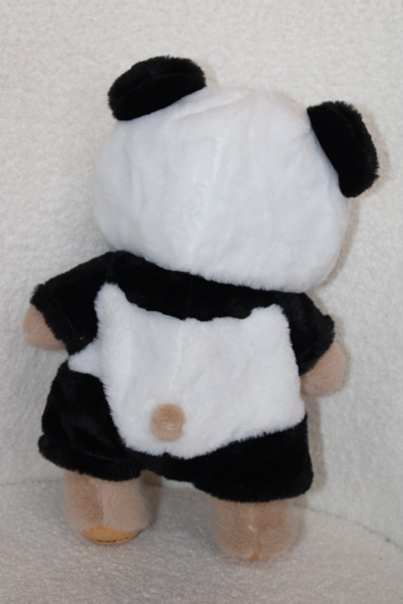 Peluche d’ours deguisé en panda